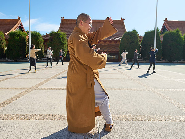 monk teaching tai chi at Nan Tien Temple