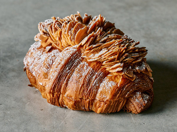 an almond croissant at Lune Croissanterie