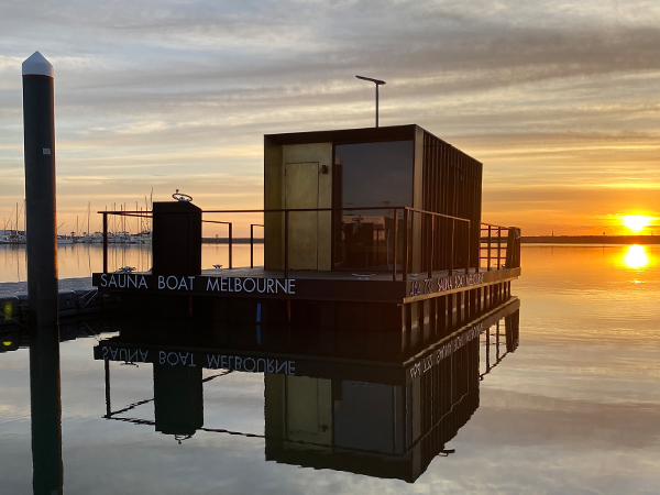 A floating sauna at sunset.