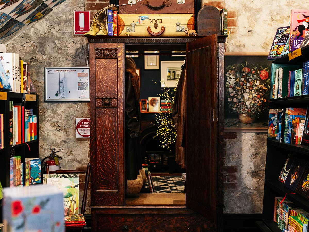 girl walking into wardrobe at Paper Bird book store in fremantle WA