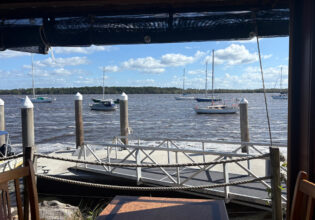 View of the water from inside Chez Basho Boatshed Cafe in Iluka