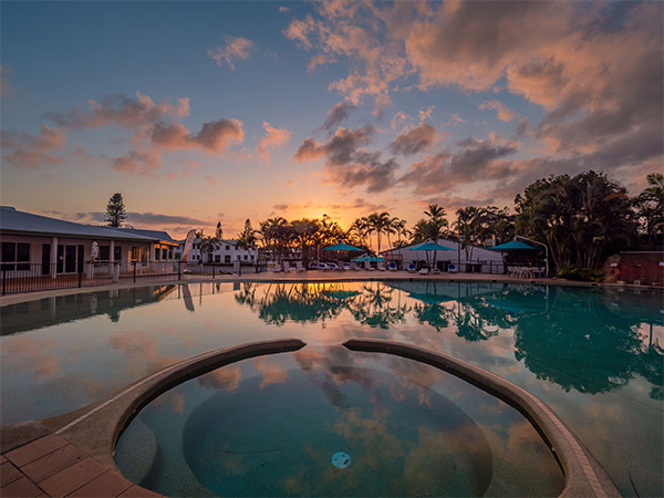 K'gari Beach Resort pool at sunset