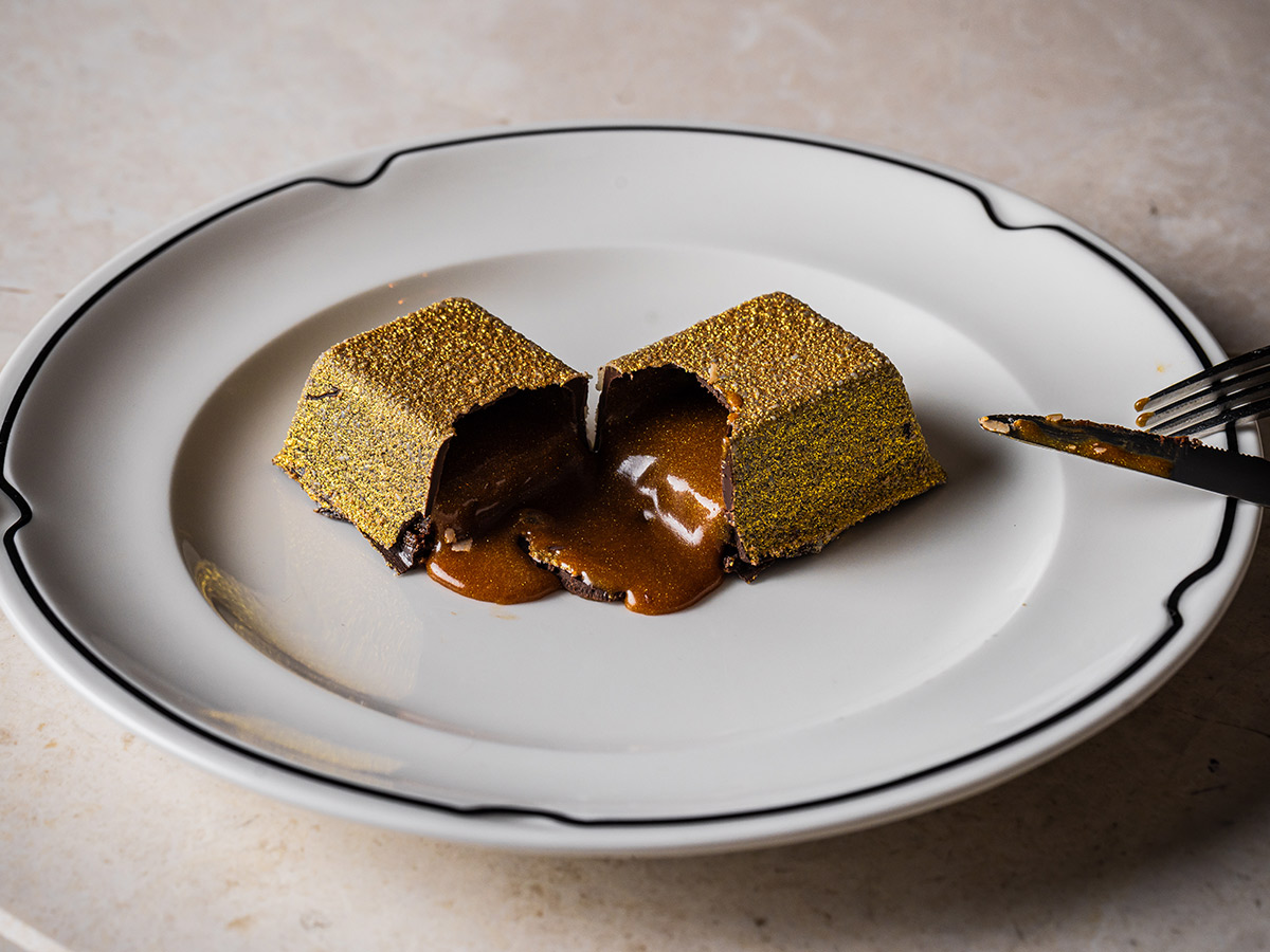 Luke's Golden Chocolate Bar dessert after it's been cut open at Luke's Kitchen Sydney